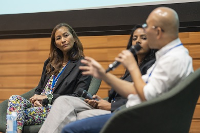 Close-up photo of three people during an event.