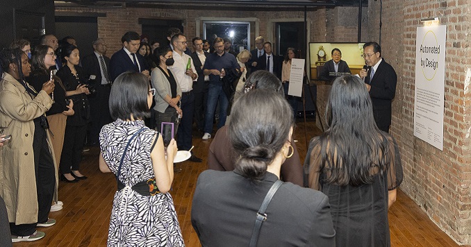 Person giving a speech at a podium with people around him