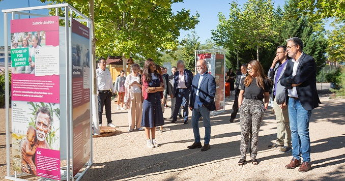 Visitors viewing exhibition panels related to SDGS on display outside