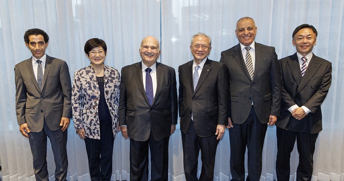 Six people posing for a group photo.