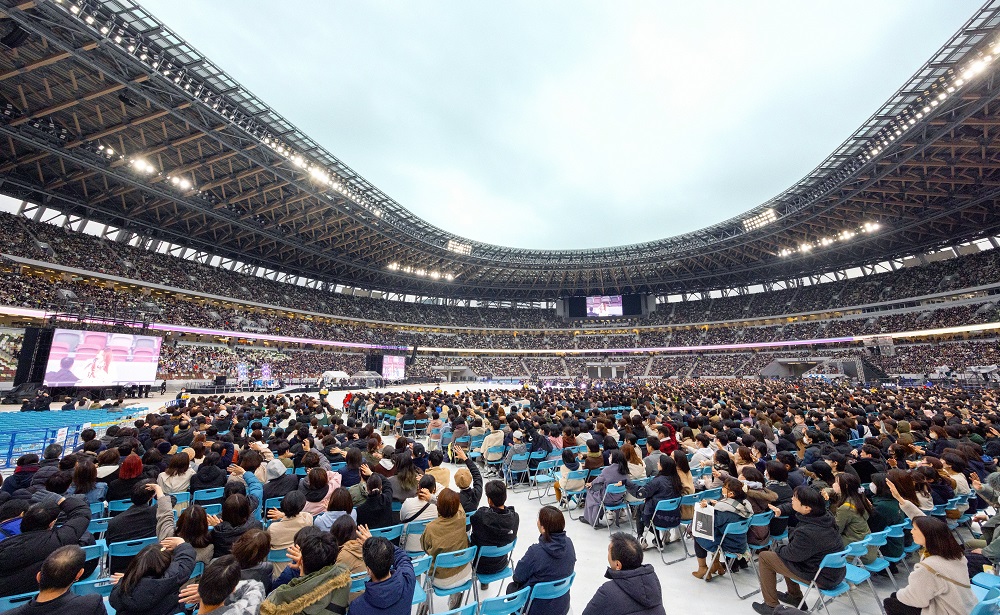 Participants of an event seated in a stadium.
