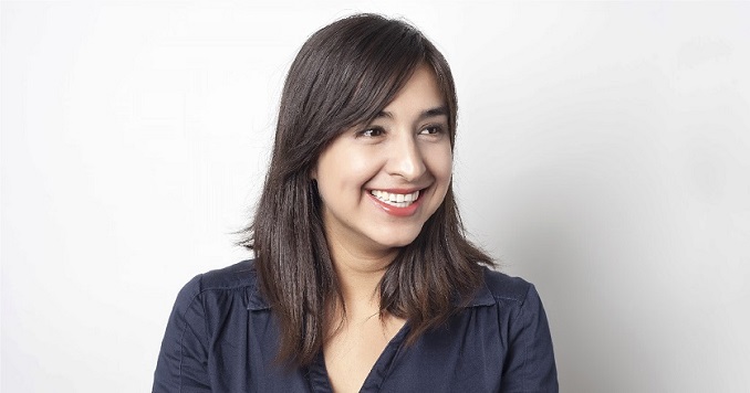 Profile photo of Natalia looking off to the side smiling.
