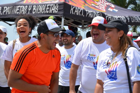 A close shot of a small group of laughing men and women