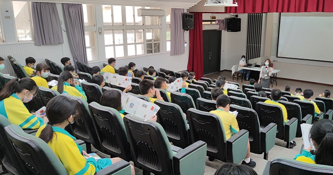 A TSA docent speaking to an auditorium of students